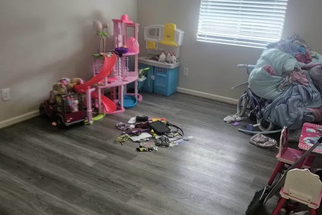 a room with toys and wooden floor