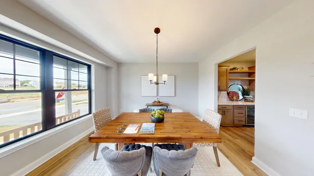 a view of a dining room with furniture window and outside view