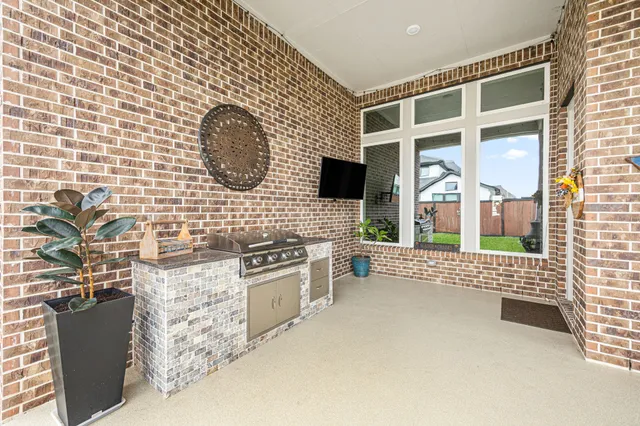 a view of an house with backyard and porch