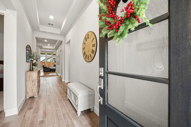 a view of a hallway view with wooden floor and staircase