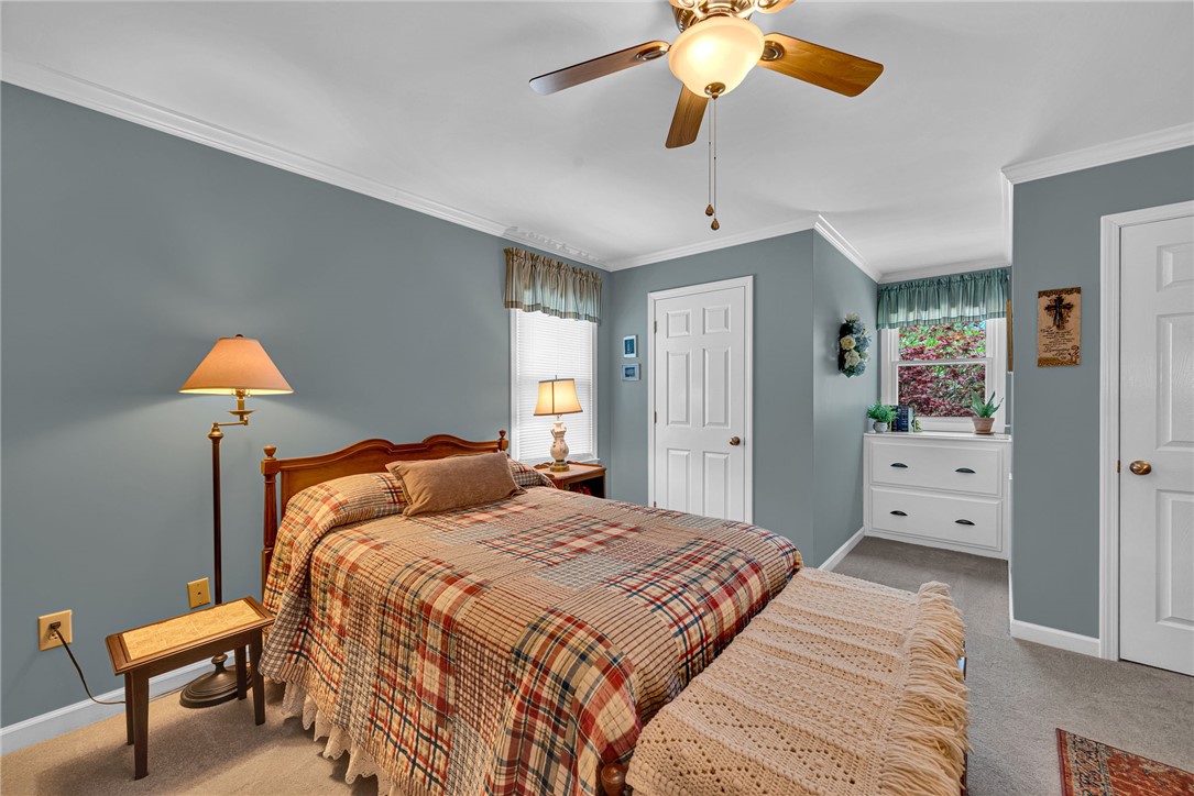 1010 Ridgeview Drive Pendleton, SC 29670 - Photo 30 of 47 This cozy bedroom features a ceiling fan, crown molding, and a bright window.