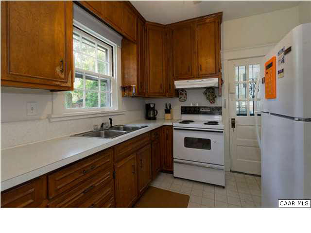 201 Cleveland Avenue Charlottesville, VA 22903 - Photo 5 of 13 a kitchen with appliances cabinets and a sink