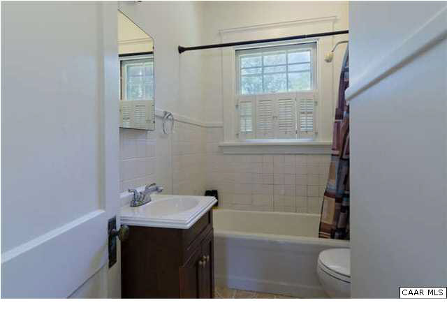 201 Cleveland Avenue Charlottesville, VA 22903 - Photo 8 of 13 a bathroom with a sink a toilet and tub