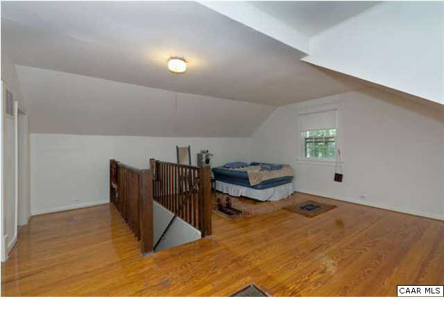 201 Cleveland Avenue Charlottesville, VA 22903 - Photo 9 of 13 a living room with furniture and a wooden floor