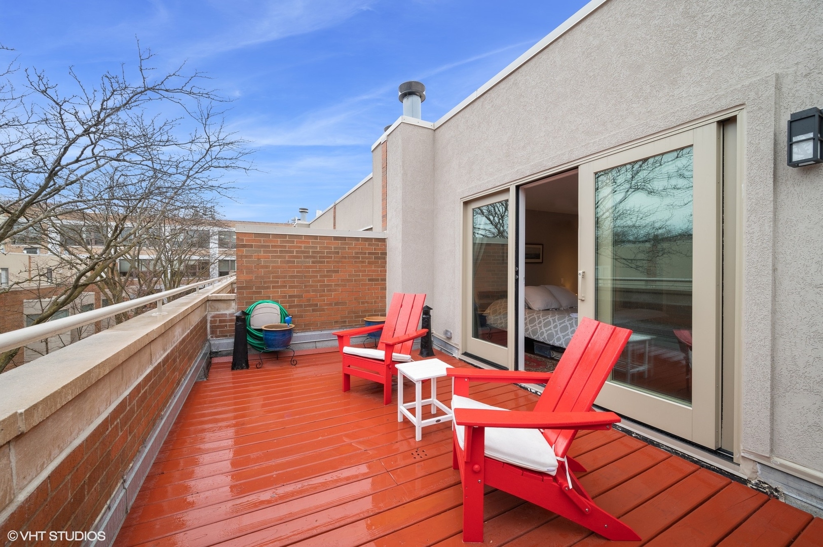 2024 North Racine Avenue, Unit R Chicago, IL 60614 - Photo 18 of 32 a balcony with chairs and wooden floor