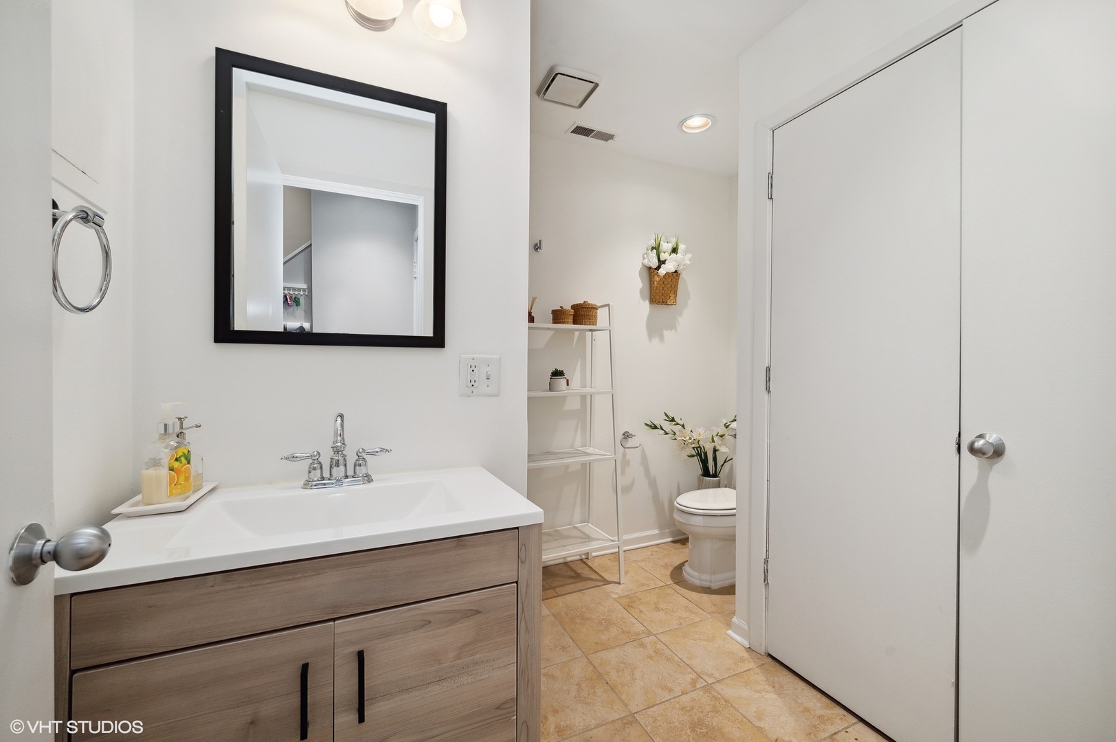 2024 North Racine Avenue, Unit R Chicago, IL 60614 - Photo 26 of 32 a bathroom with a toilet sink and mirror