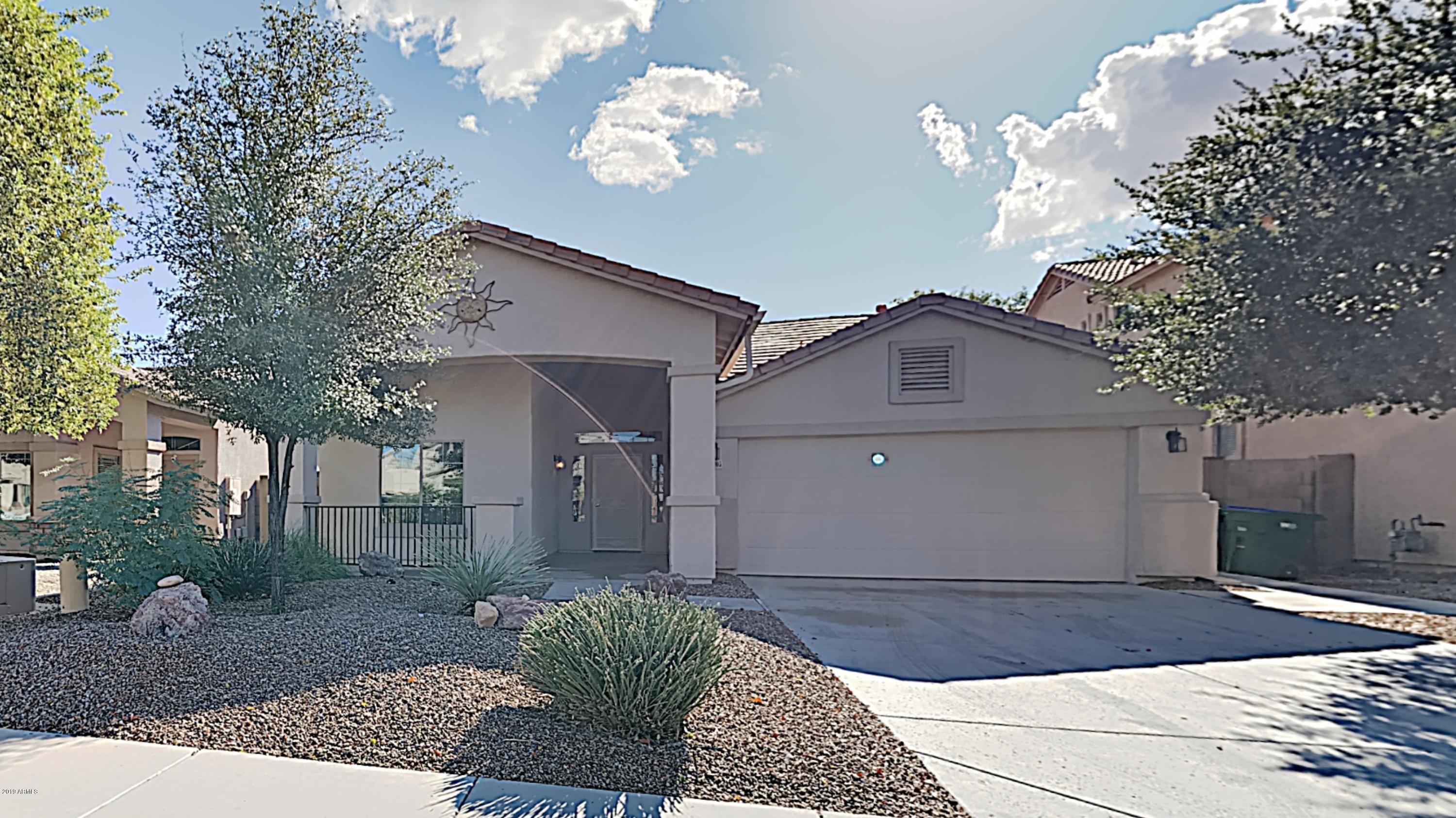 43905 Roth Road Maricopa, AZ 85138 - Photo 1 of 16 a view of a house with a yard and potted plants
