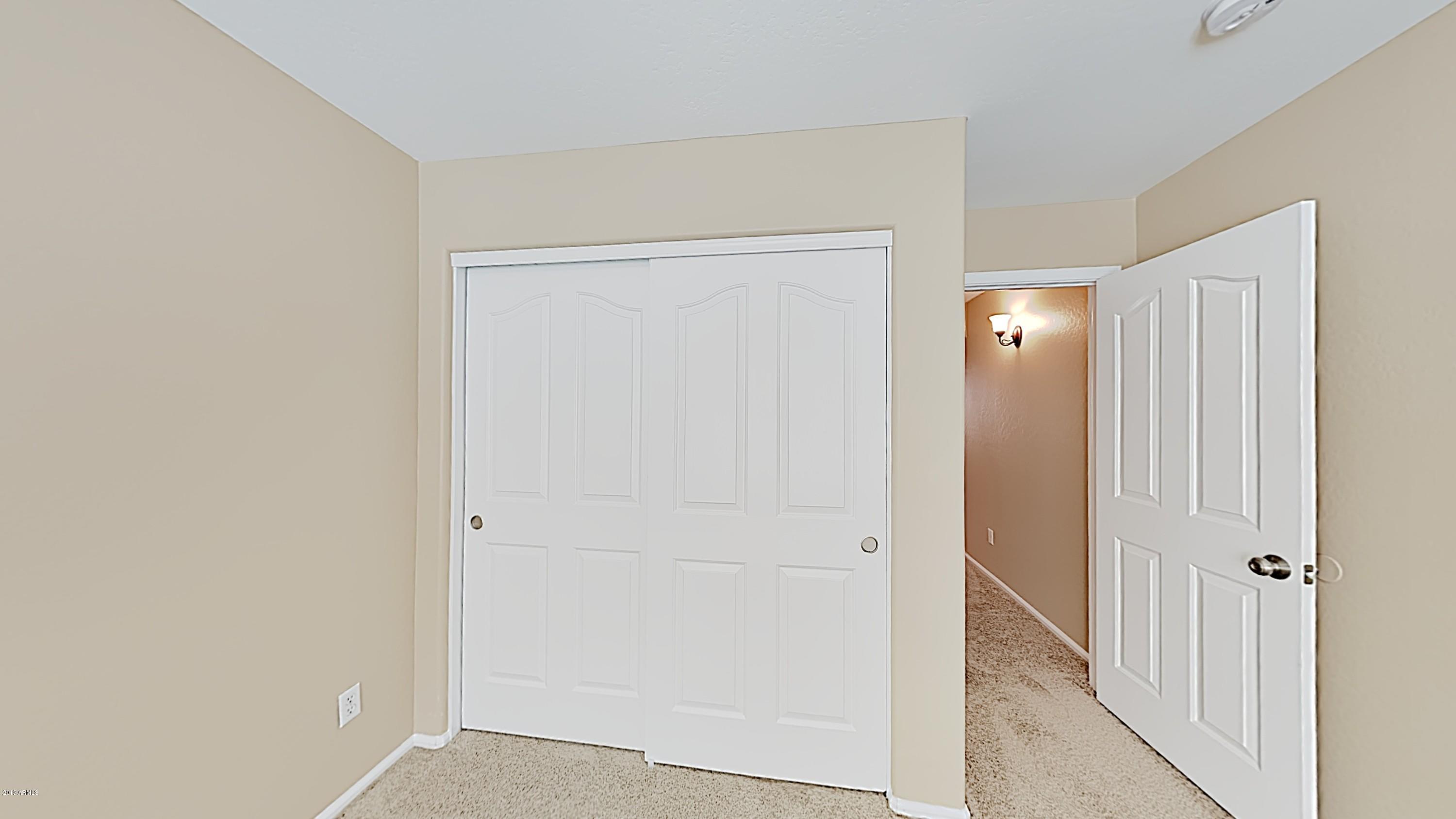 43905 Roth Road Maricopa, AZ 85138 - Photo 12 of 16 a view of a hallway with closet area