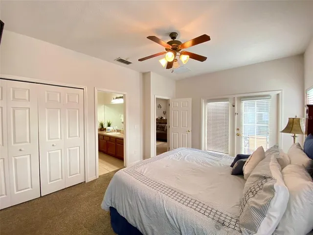 a bedroom with bed and window