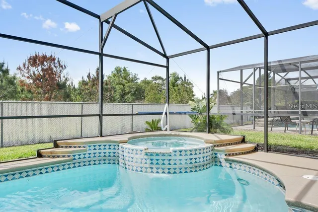 a view of swimming pool with outdoor seating
