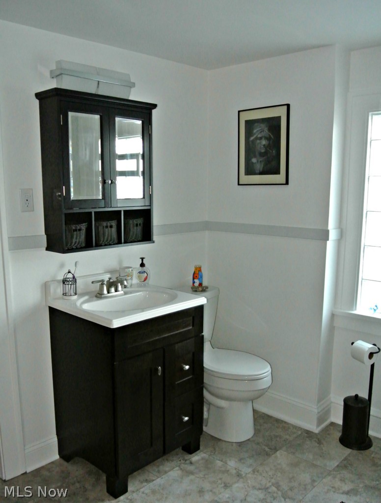 2220 Ralph Avenue Cleveland, OH 44109 - Photo 13 of 20 Completely remodeled half bath off hall and master bedroom.