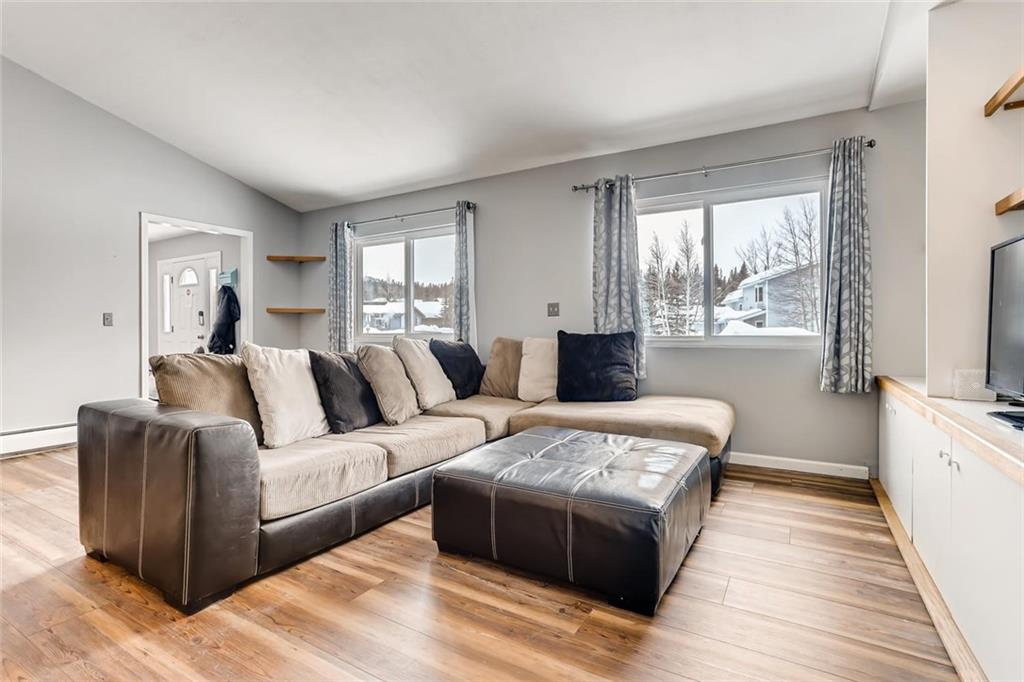 125 Reiling Road Breckenridge, CO 80424 - Photo 2 of 35 a living room with furniture and a flat screen tv