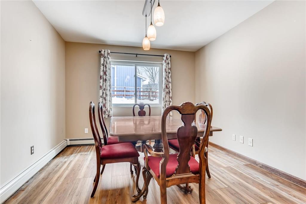 125 Reiling Road Breckenridge, CO 80424 - Photo 12 of 35 a view of a dining room with furniture a chandelier and wooden floor