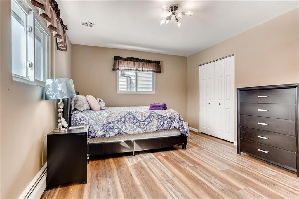 125 Reiling Road Breckenridge, CO 80424 - Photo 14 of 35 a bedroom with a bed and a dresser