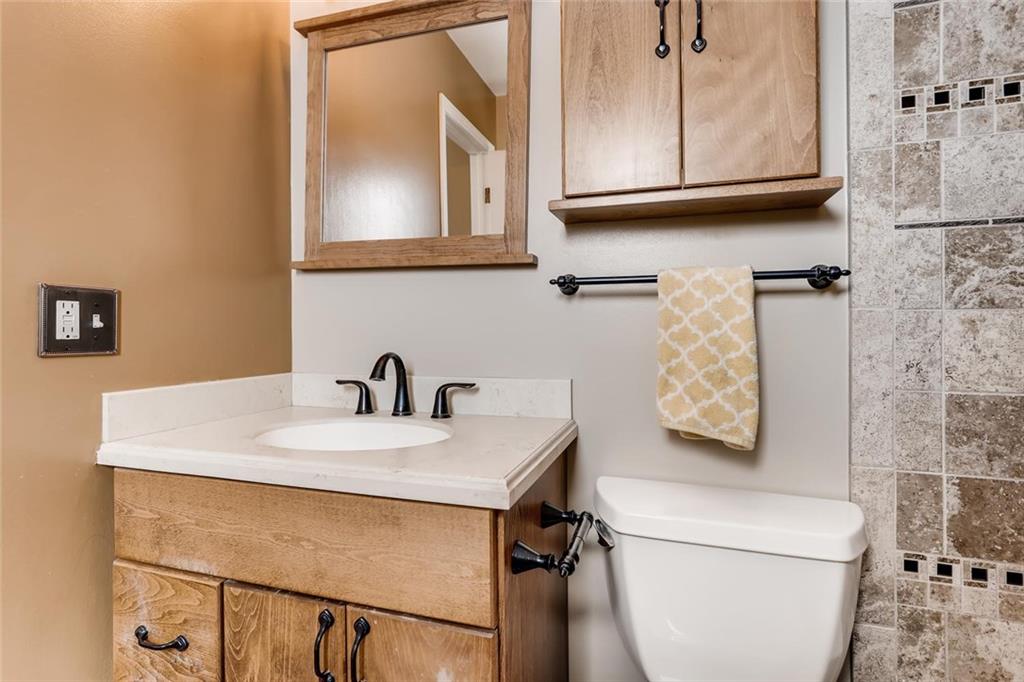 125 Reiling Road Breckenridge, CO 80424 - Photo 16 of 35 a bathroom with a sink toilet and mirror