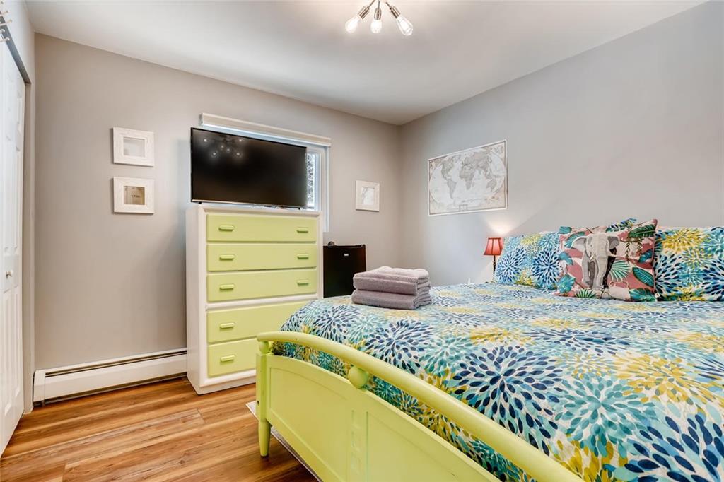 125 Reiling Road Breckenridge, CO 80424 - Photo 17 of 35 a bedroom with a bed and furniture