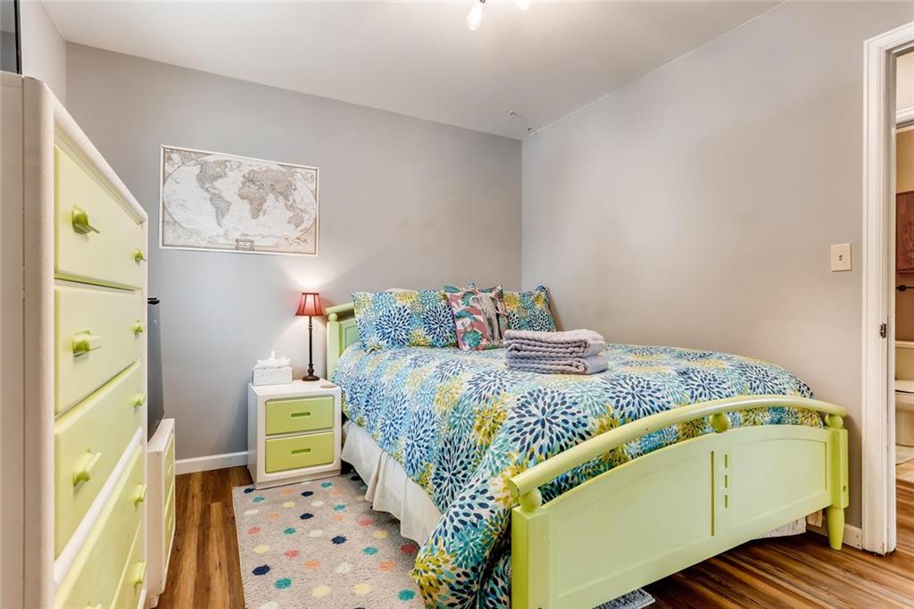 125 Reiling Road Breckenridge, CO 80424 - Photo 18 of 35 a bedroom with a bed and wooden floor