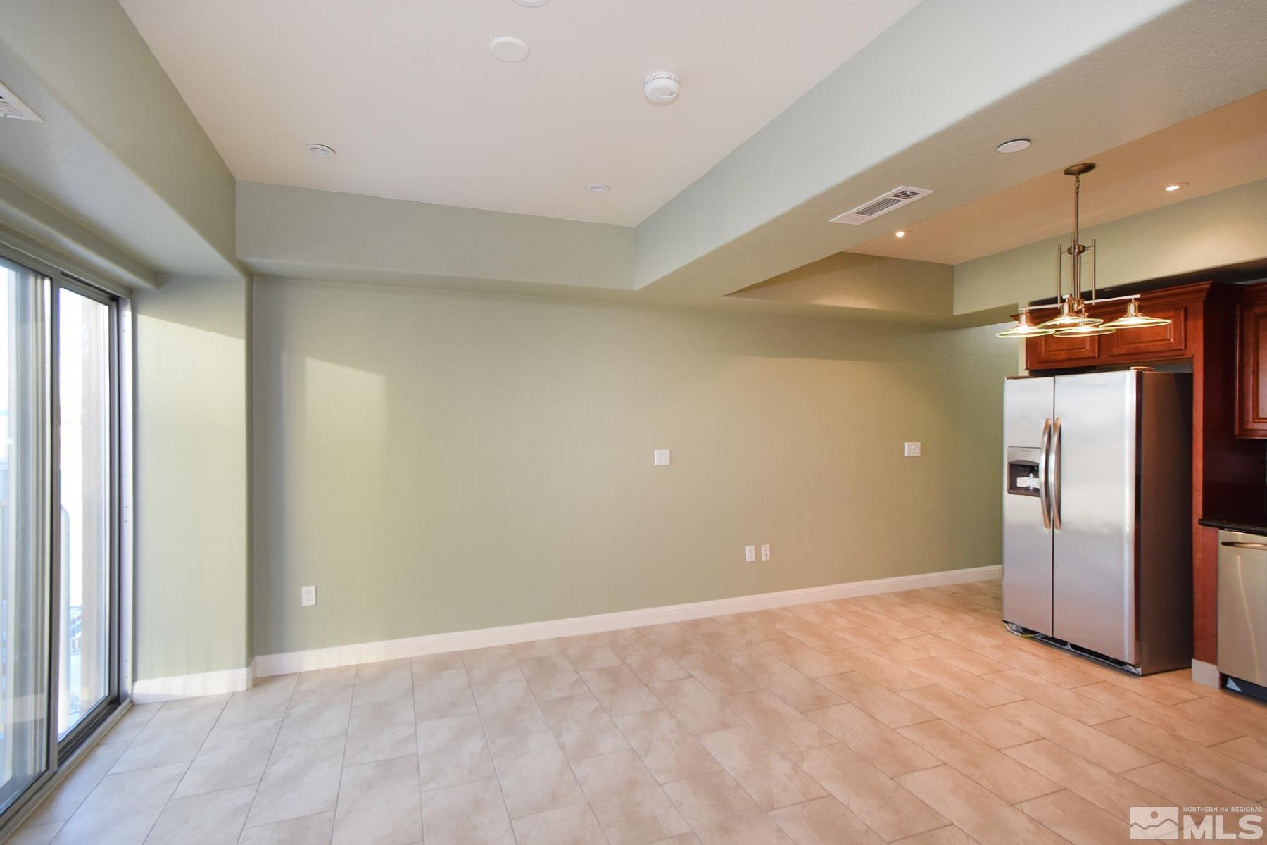 200 West 2nd Street, Unit 1108 Reno, NV 89501 - Photo 8 of 16 a view of an empty room with a fireplace