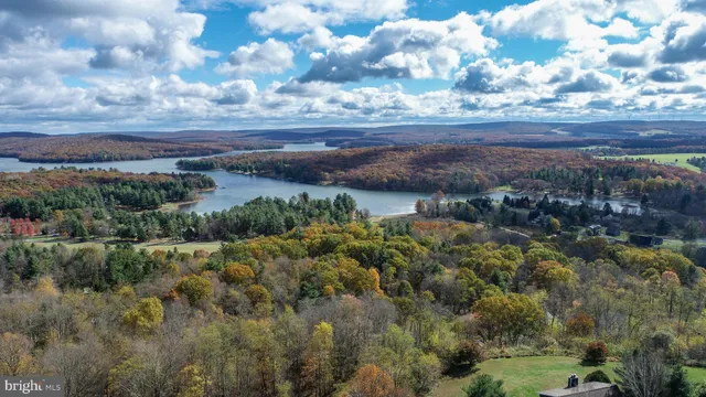 a view of a lake with green field