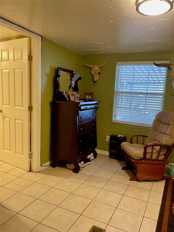 2334 San Bar Road, Unit 13 Graford, TX 76449 - Photo 13 of 33 a living room with a couch and a dresser with wooden floor