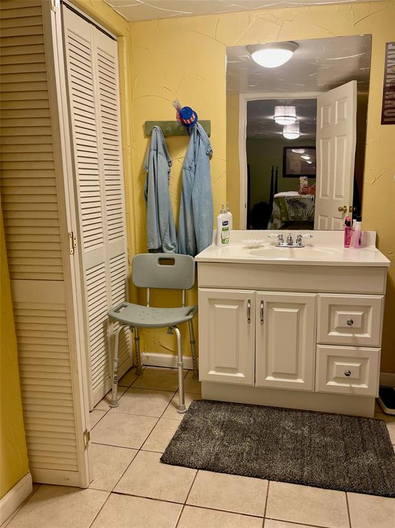 2334 San Bar Road, Unit 13 Graford, TX 76449 - Photo 14 of 33 a bathroom with a sink a vanity and a mirror