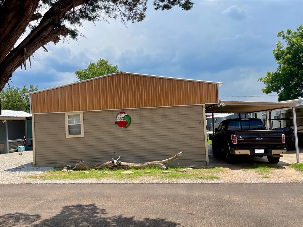 2334 San Bar Road, Unit 13 Graford, TX 76449 - Photo 2 of 33 a car parked in front of a house