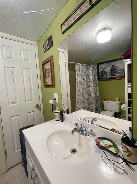 2334 San Bar Road, Unit 13 Graford, TX 76449 - Photo 23 of 33 a bathroom with a sink double vanity and a mirror
