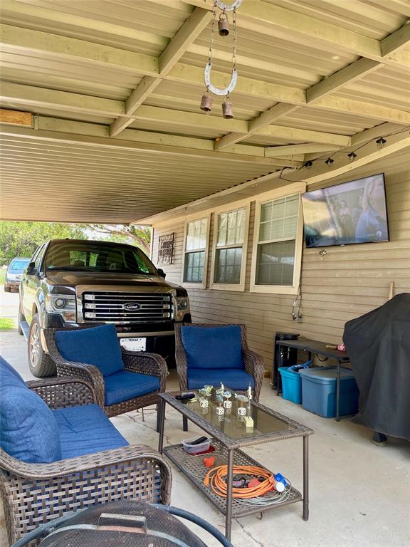 2334 San Bar Road, Unit 13 Graford, TX 76449 - Photo 26 of 33 a living room with furniture and a flat screen tv