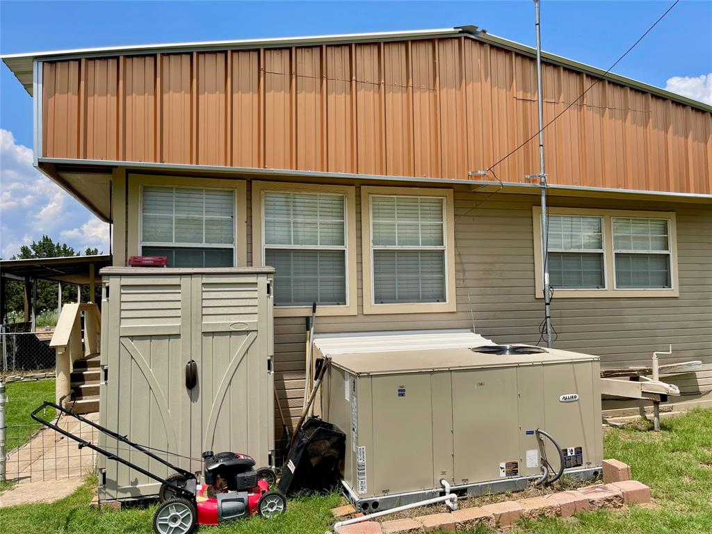 2334 San Bar Road, Unit 13 Graford, TX 76449 - Photo 27 of 33 a view of a house with a garage and washing machine