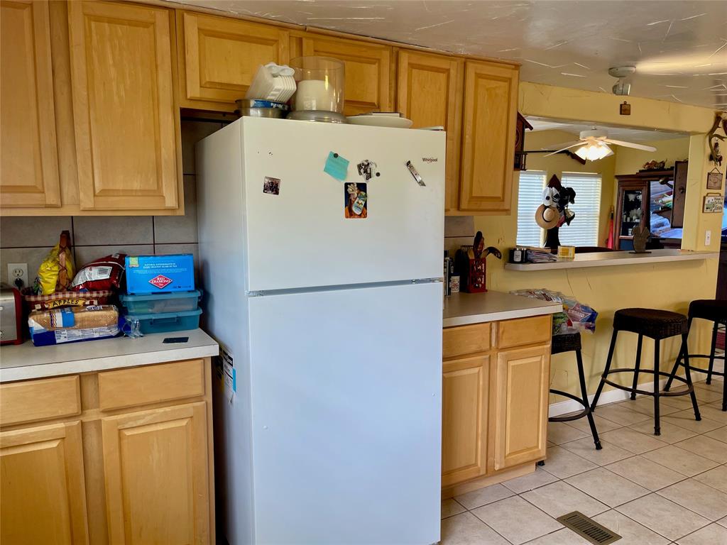 2334 San Bar Road, Unit 13 Graford, TX 76449 - Photo 9 of 33 a white refrigerator freezer sitting in a kitchen