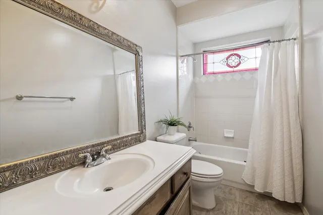 a bathroom with a toilet a sink and a bathtub