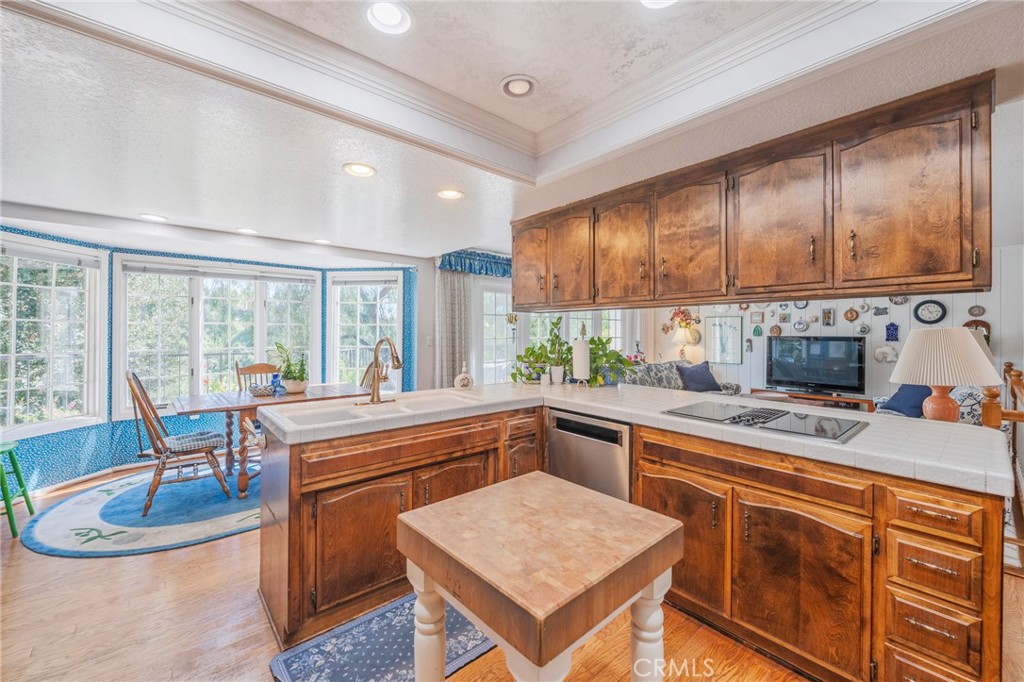 1920 Flint Rock Road Diamond Bar, CA 91765 - Photo 18 of 62 a kitchen with a stove a sink a refrigerator dining table and chairs