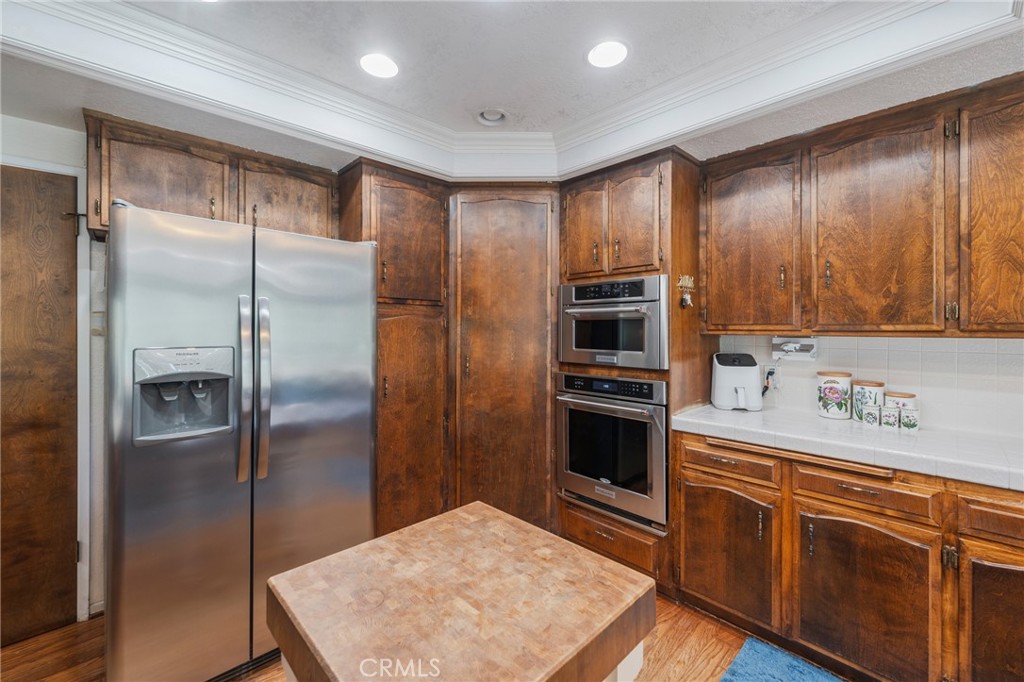 1920 Flint Rock Road Diamond Bar, CA 91765 - Photo 19 of 62 a kitchen with stainless steel appliances granite countertop a refrigerator and a stove