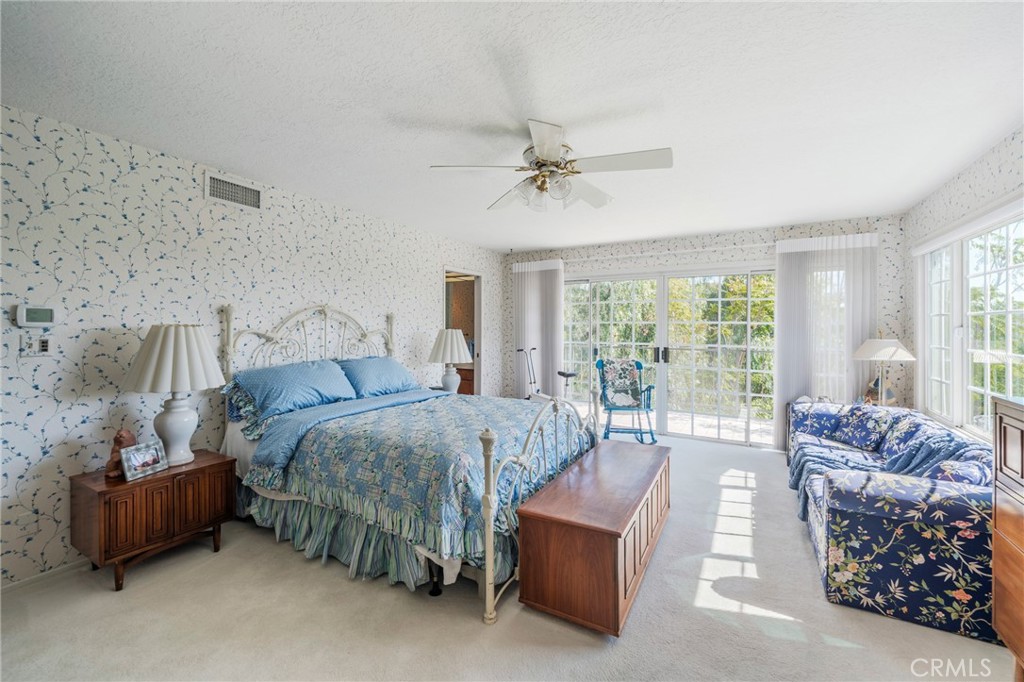 1920 Flint Rock Road Diamond Bar, CA 91765 - Photo 23 of 62 a bedroom with a bed and a couch with large mirror