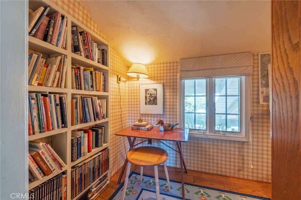 1920 Flint Rock Road Diamond Bar, CA 91765 - Photo 27 of 62 a book shelf with lounge chair in front of a door