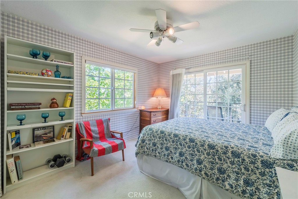 1920 Flint Rock Road Diamond Bar, CA 91765 - Photo 29 of 62 a bedroom with a bed a large window with table and chairs