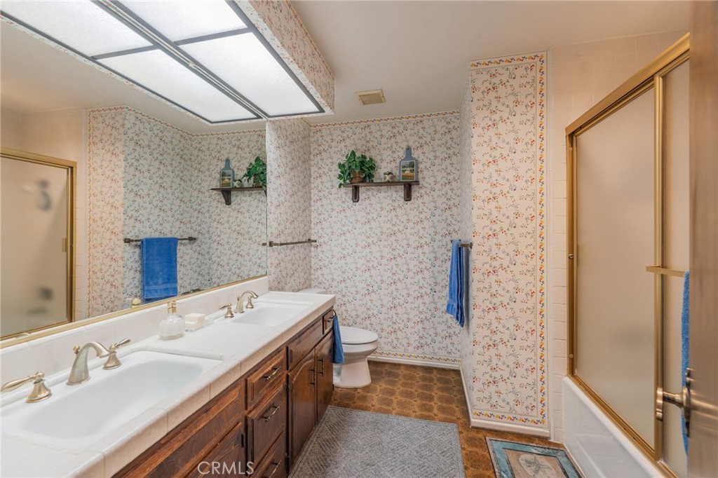 1920 Flint Rock Road Diamond Bar, CA 91765 - Photo 30 of 62 a bathroom with a sink and a mirror