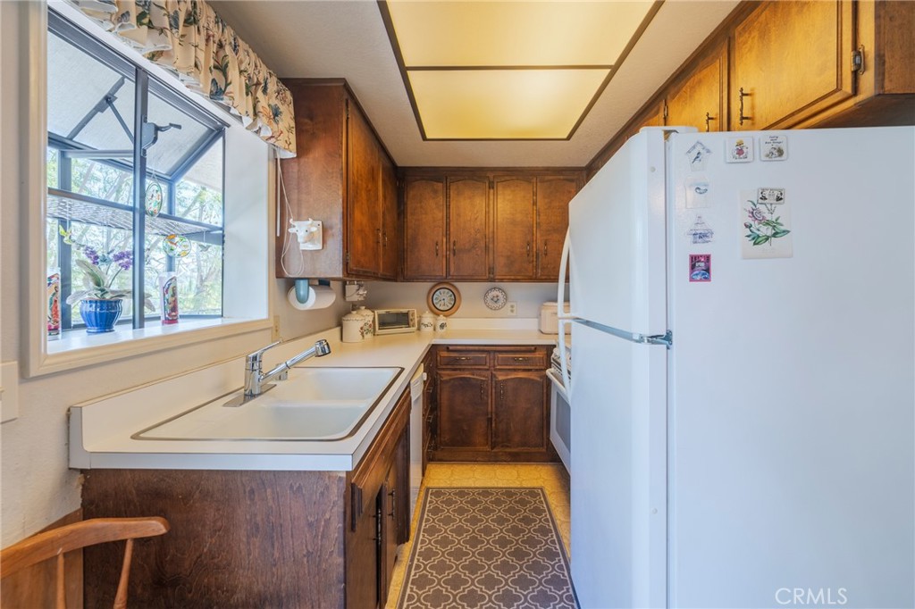 1920 Flint Rock Road Diamond Bar, CA 91765 - Photo 34 of 62 a utility room with a sink a washer and dryer
