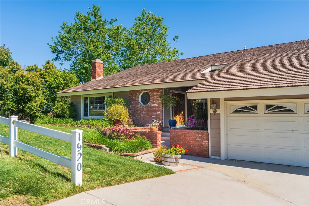 1920 Flint Rock Road Diamond Bar, CA 91765 - Photo 47 of 62 a front view of a house with a yard and porch
