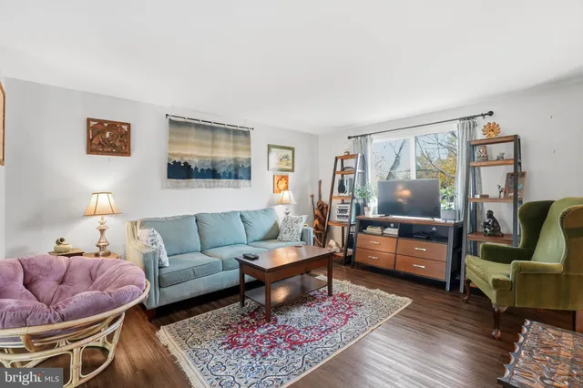 a living room with furniture and a rug