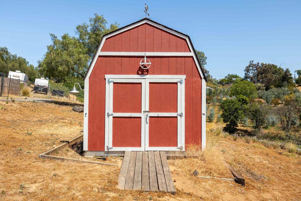 9908 West Lilac Road Escondido, CA 92026 - Photo 25 of 41 Work shed w/electric, mobile AC, workbench & tool cabinet