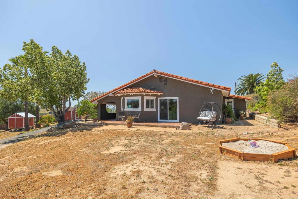 9908 West Lilac Road Escondido, CA 92026 - Photo 6 of 41 Back patio with view and sandbox