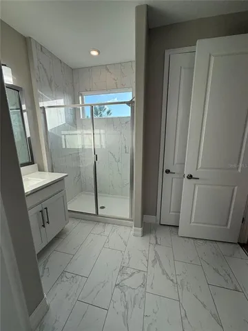 a bathroom with a shower and a toilet