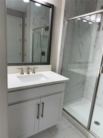 a bathroom with a sink and a mirror