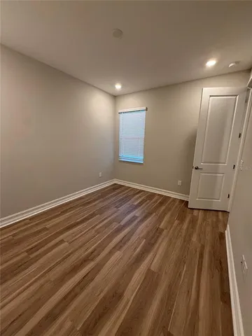 a view of room with wooden floor