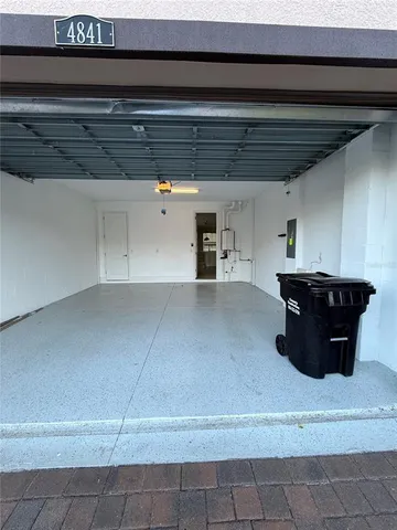 a kitchen with a cabinets and chandelier