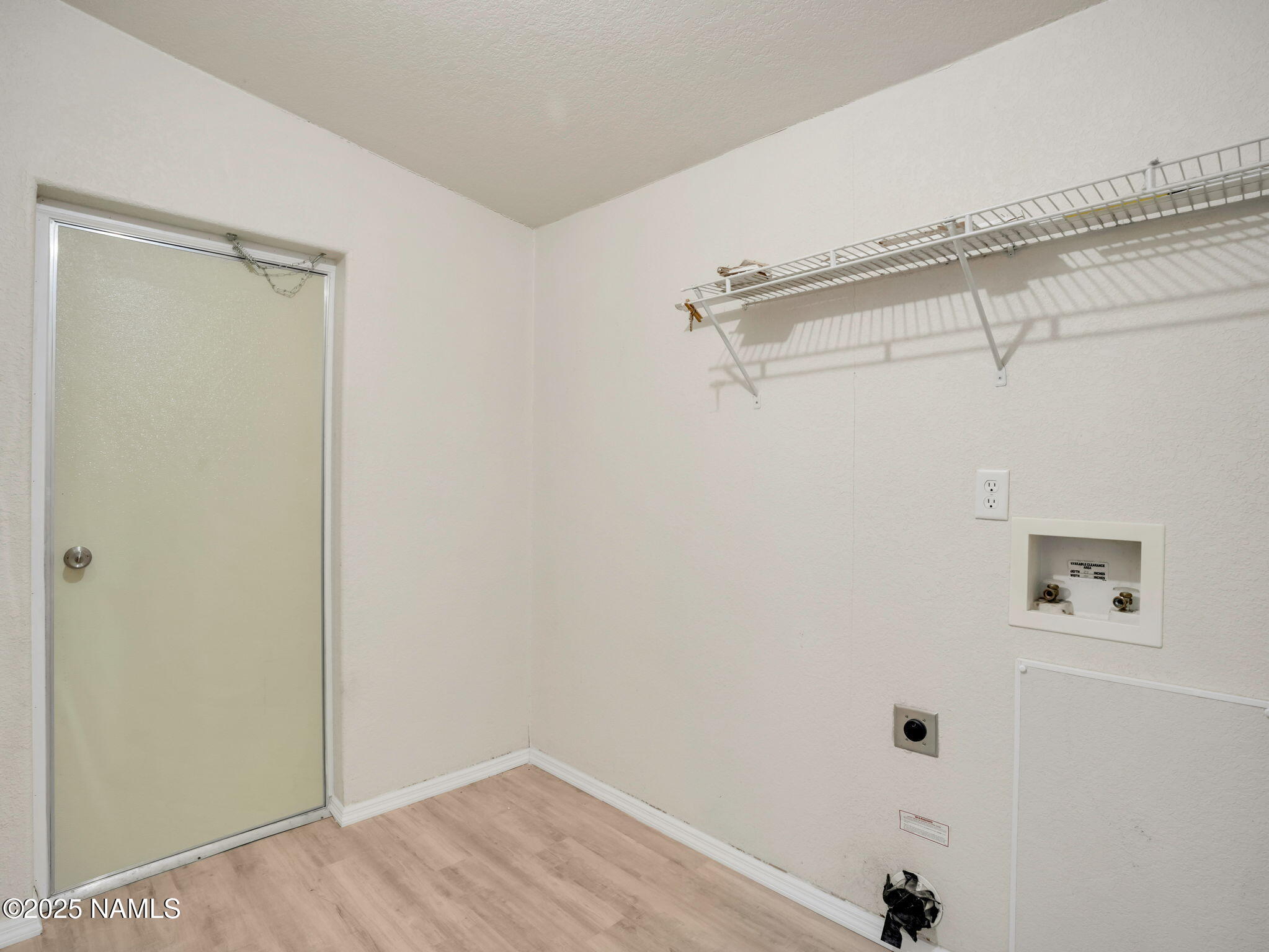 6512 North Santa Fe Road Williams, AZ 86046 - Photo 19 of 35 a view of a room with racks on the wall