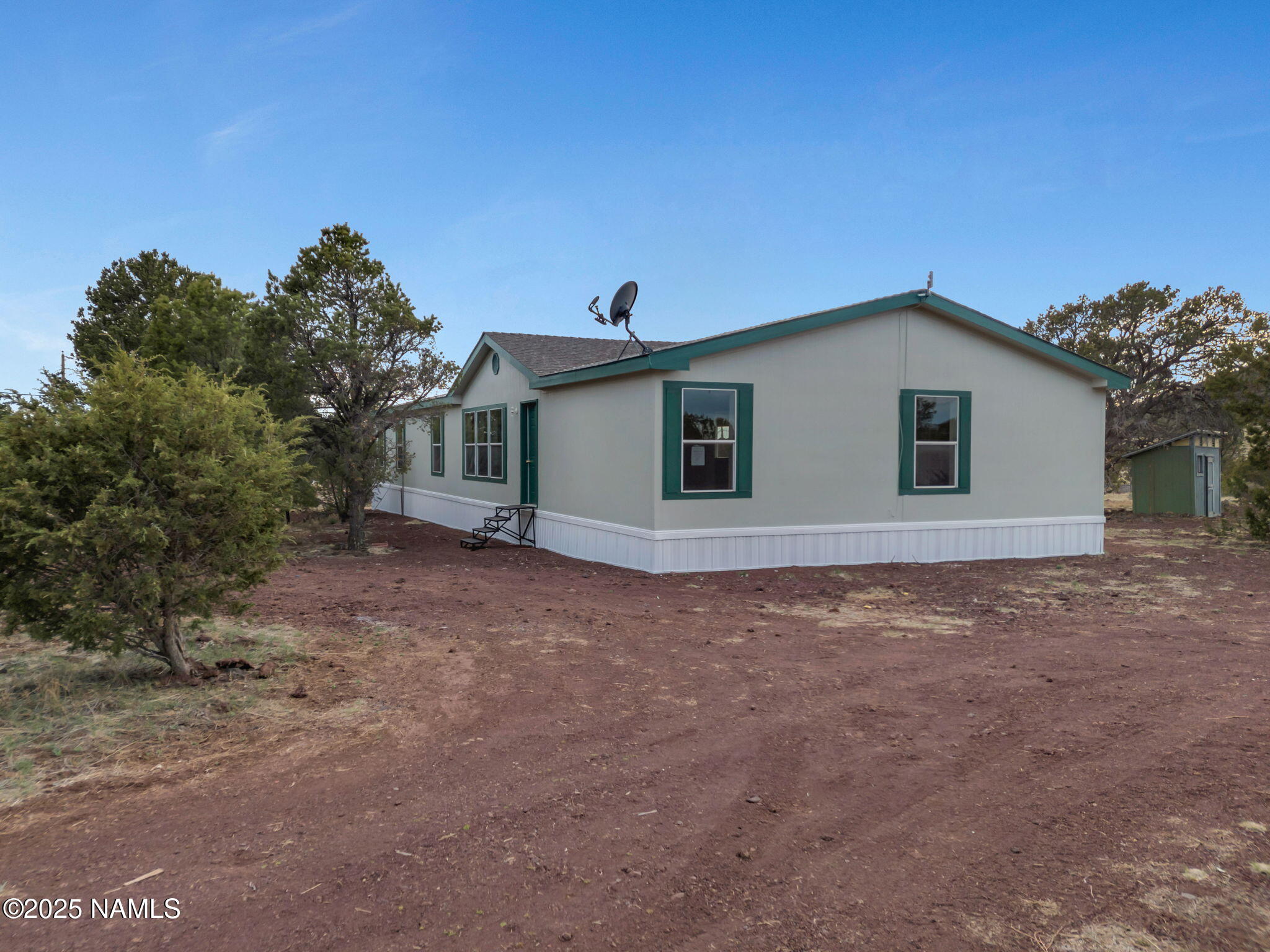 6512 North Santa Fe Road Williams, AZ 86046 - Photo 21 of 35 a view of a house with a backyard