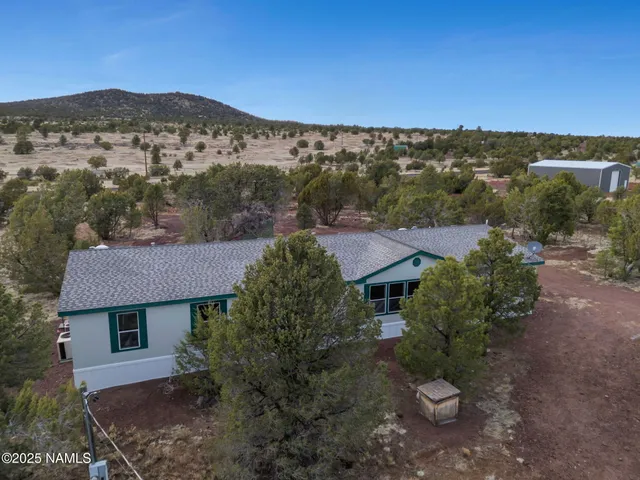 an aerial view of a house with a garden