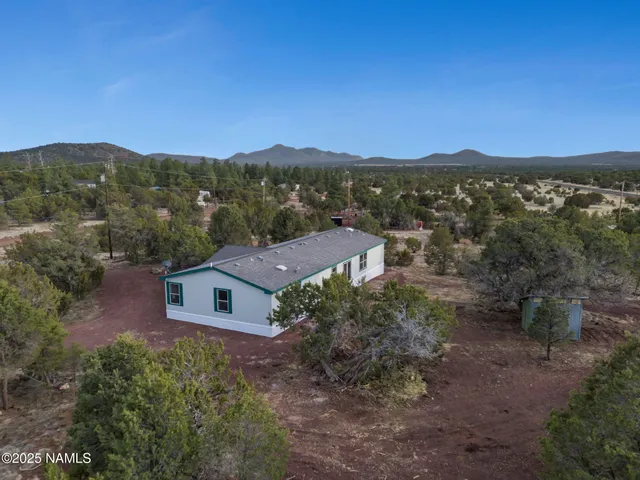 an aerial view of residential house with outdoor space